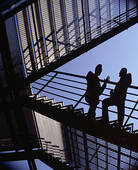 two-men-on-stairs-talking-low-angle-stock-image__x18758385